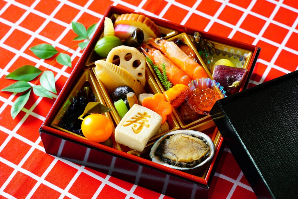 Traditional Japanese New Year osechi ryori served in a lacquered jubako box