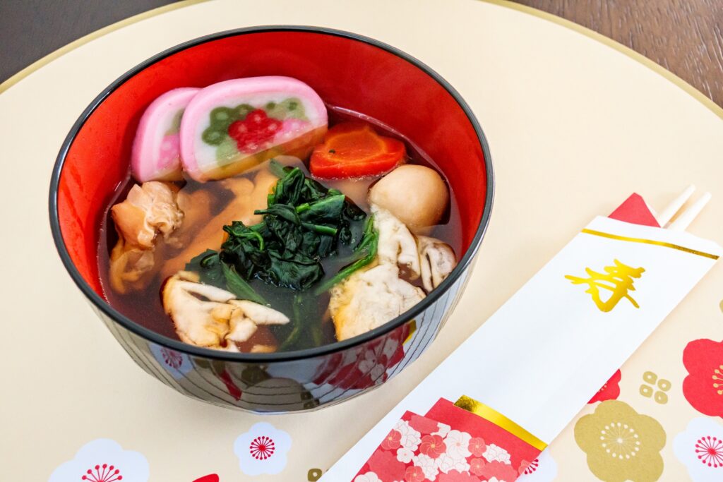 Zoni soup with mochi rice cakes, vegetables, and kamaboko fish cakes